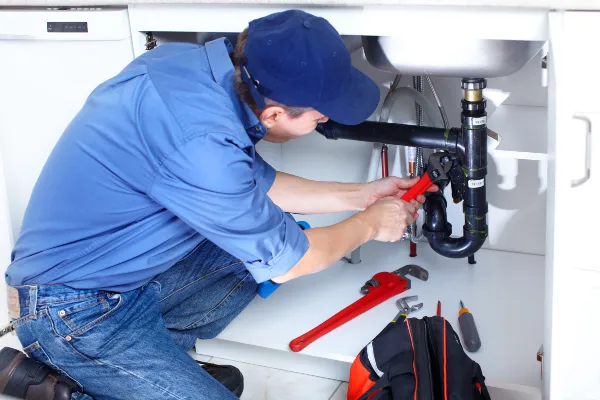 a male plumber fixing a toilet from quality plumbing leander in Leander, TX Plumber near me a male plumber fixing a toilet from quality plumbing leander in Leander, TX Plumber near me